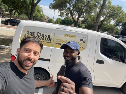 1st Class Locksmith Prosper technician smiling with a happy customer after a locksmith service, with a marked van in the background.
